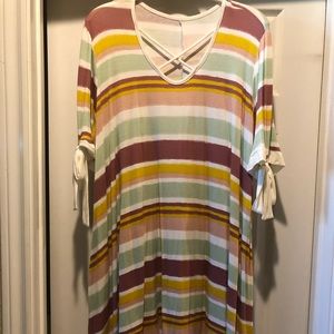 A really cute shirt. Shark bite hem.Ties on sleeve